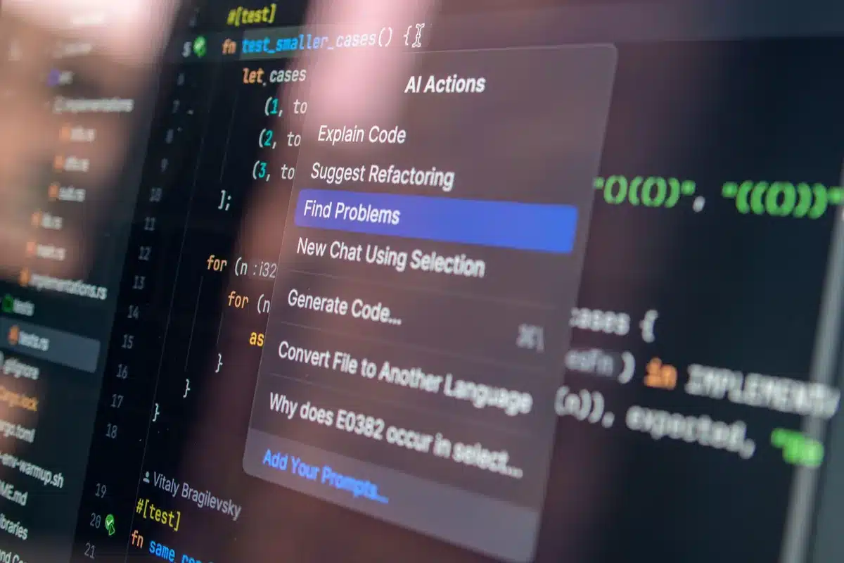 Sviluppatore al lavoro su laptop con interfaccia AI generativa sullo schermo